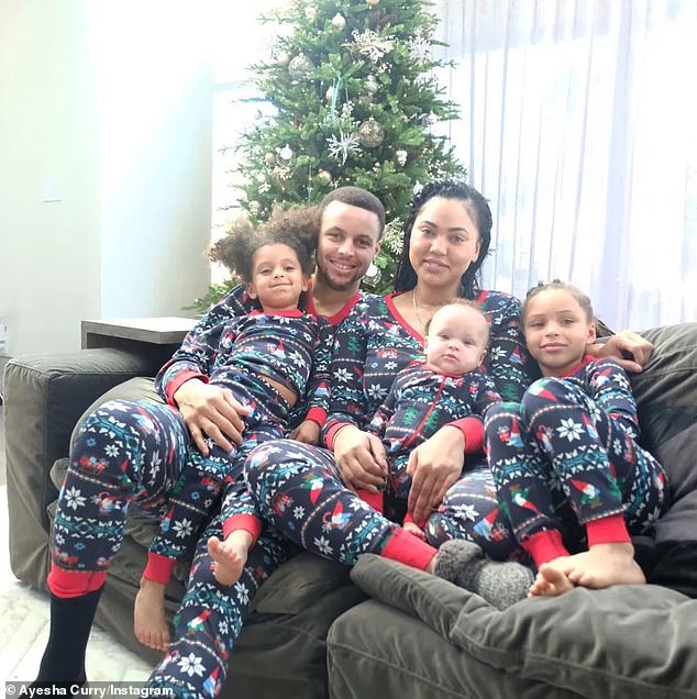 IN THE PHOTO: Stephen, Ayesha, Riley (far right), Ryan (far left) and Canon Curry (on Ayesha's lap)