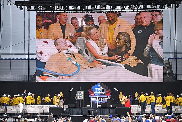 McMichael's induction took place at his home in Illinois, surrounded by his wife and teammates.