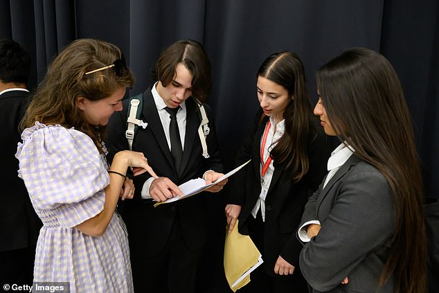 Hundreds of thousands of students in England, Wales and Northern Ireland received their exam results today (pictured: City of London Academy students)