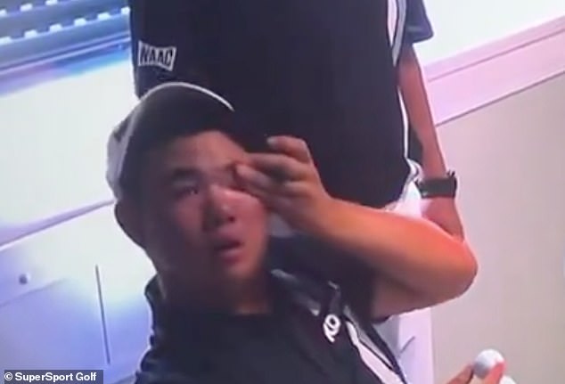 South Korea's Kim Jong-un was photographed wiping a tear from his left eye at Le Golf National on Sunday