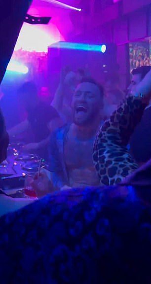 The UFC star was seen smiling and dancing inside the nightclub.