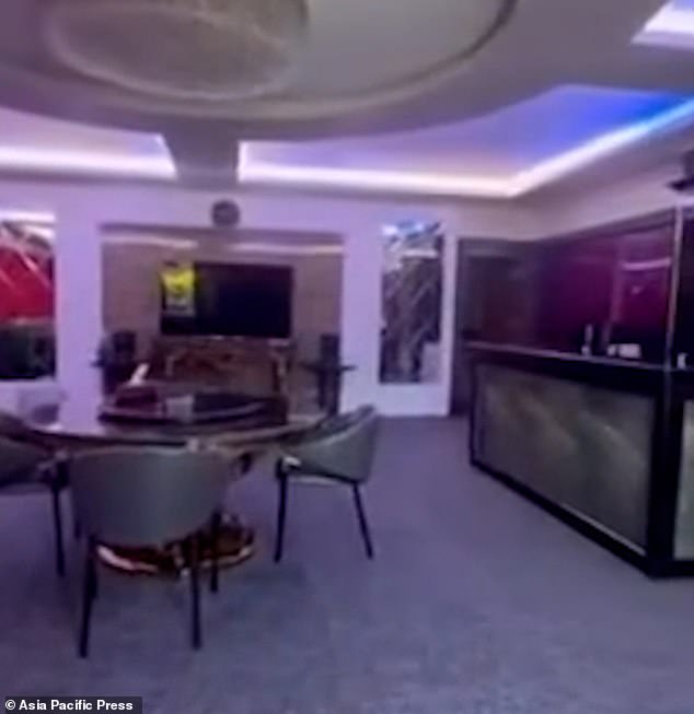 Footage shows police opening a hidden door leading to a lavishly decorated hall, accessed through a labyrinth of secret passages in a cathedral at the vast 75-acre compound owned by Quiboloy in Davao City (pictured: one of the hidden halls)