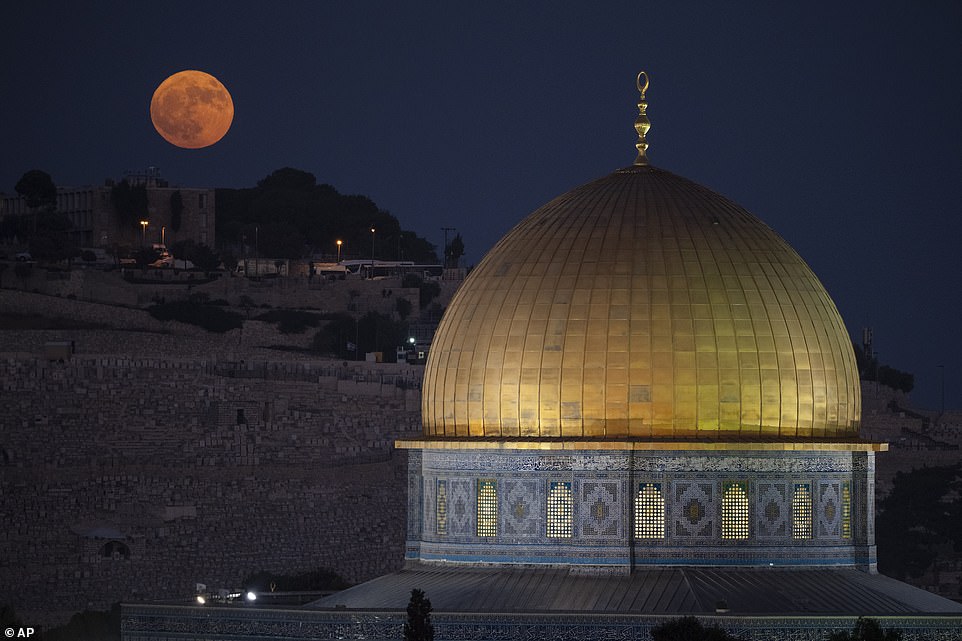 JERUSALEM: The supermoon rises behind the Dome of the Rock shrine in the Al Aqsa mosque compound in Jerusalem's Old City.