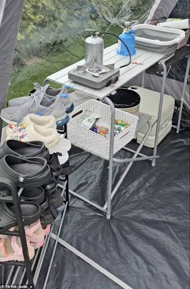 Pictured: The family even brought along a shoe rack. Jodie said she and her family were staying at Lady's Mile Holiday Park in South Devon, which features several luxury stays in static caverns and an on-site swimming pool, play areas, a games room, a bar and restaurant, and even a gym and spa.