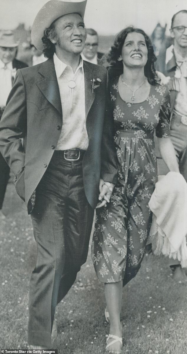 Pierre Trudeau and his wife Margaret stroll hand in hand through Heritage Park in Calgary