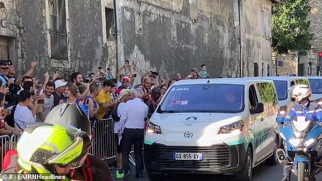 The two-time Olympic gold medalist was escorted to an Olympic van after 31 kilometers.