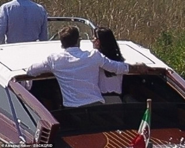 Brad put his arm around Ines during their boat ride on Saturday afternoon.