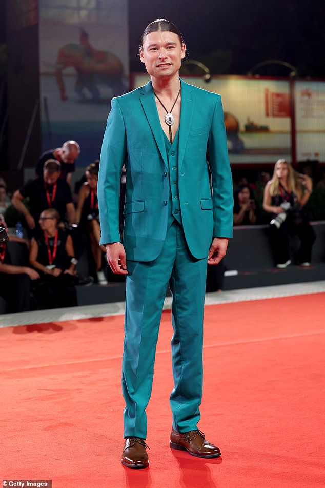 Canadian actor Phillip Forest Lewitski, 27, also attended the red carpet event and cut a distinctive figure in a vibrant teal suit.