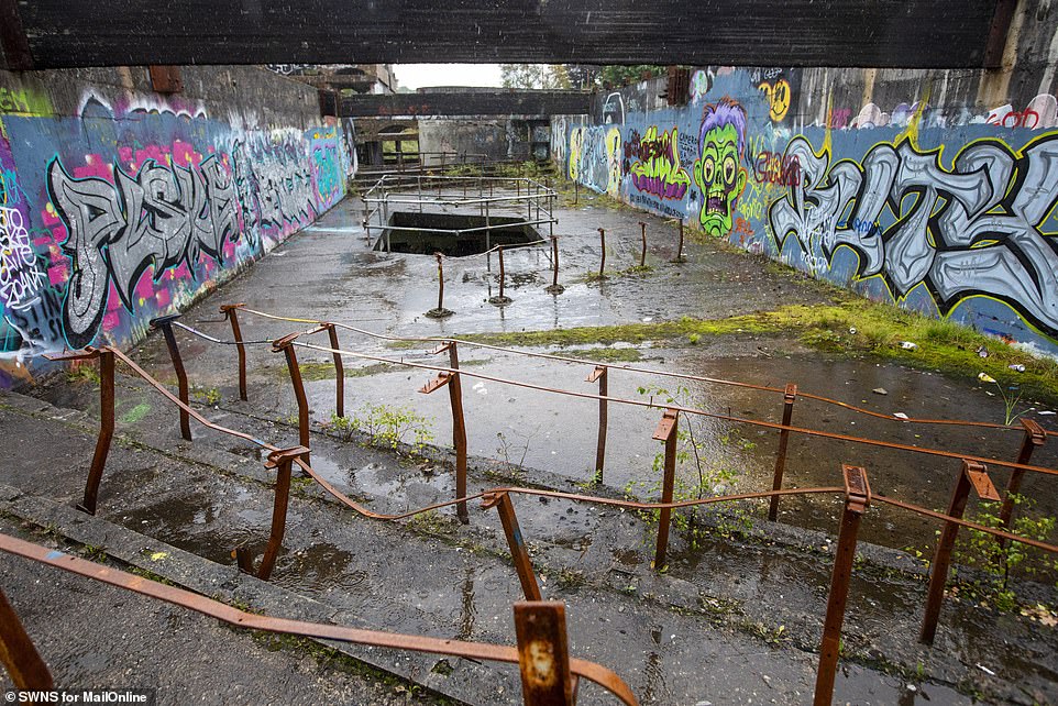 Rusted, damaged fences and graffiti (pictured) litter the historic structure, leaving it to crumble into ruin.