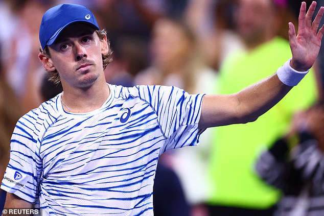 Australia's Alex de Minaur waves to the crowd after his win over Daniel Evans