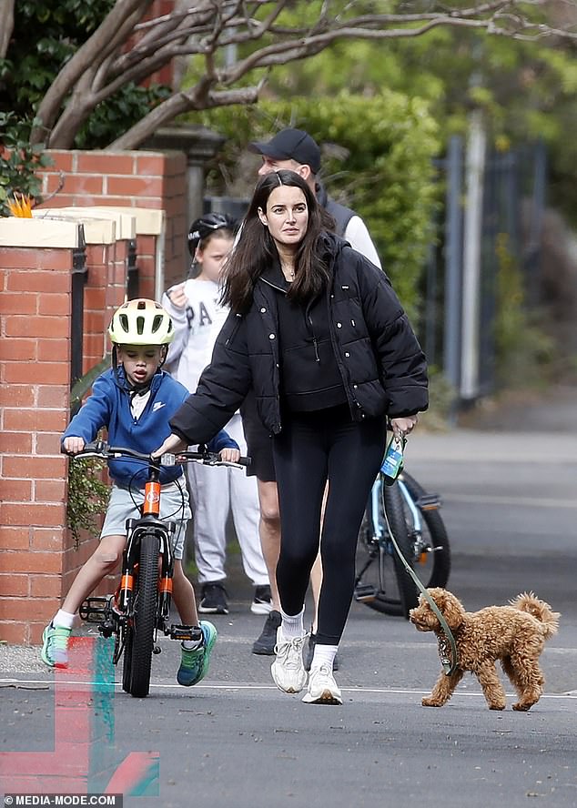 Meanwhile, Jessica, 33, was dressed in head-to-toe black as she walked her small dog and guided Carter along as he rode his bike alongside her.