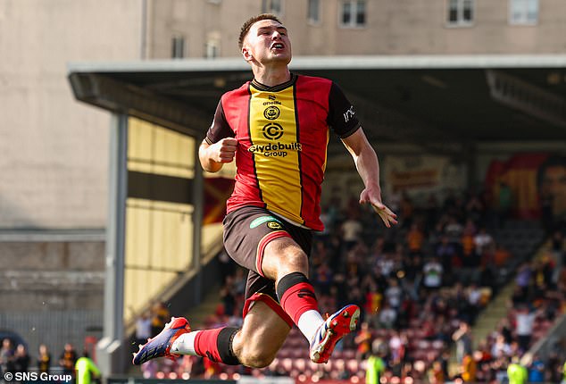 Zander MacKenzie jumps for joy after scoring a late third goal for the Jags