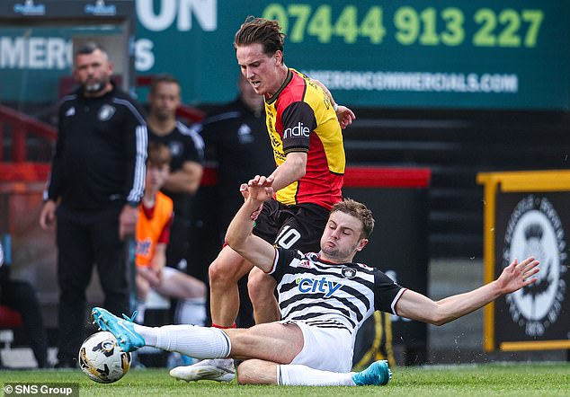 Partick Thistle's Logan Chalmers evades the challenge of Queen's Park's Jack Turner