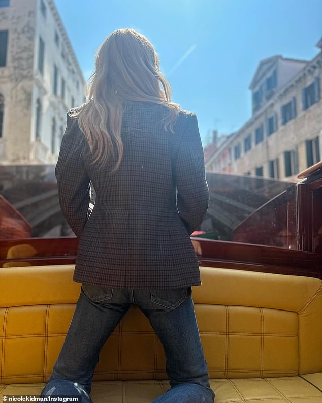 She also went for a ride on a boat along the canal, again hiding her face.