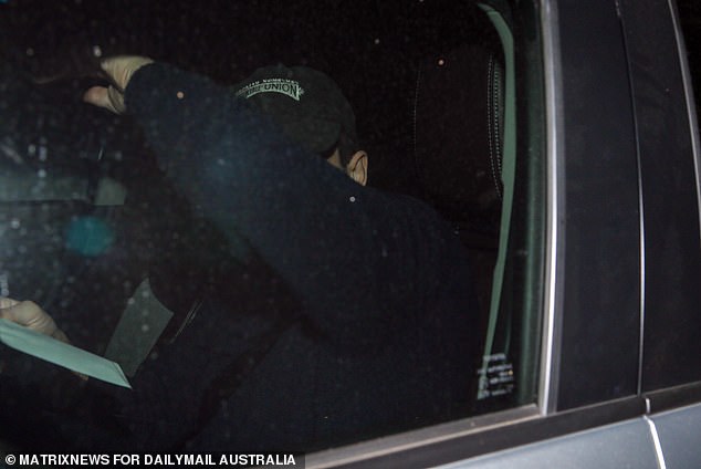 Rory Amon unsuccessfully attempted to evade the media at Dee Why police station on Sunday night.