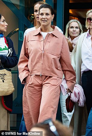 The 52-year-old, fourth in line to the Norwegian throne, was wearing a pink trouser suit as she left the Union Hotel in the picturesque fjordside village of Geirganger, where she had married yesterday.