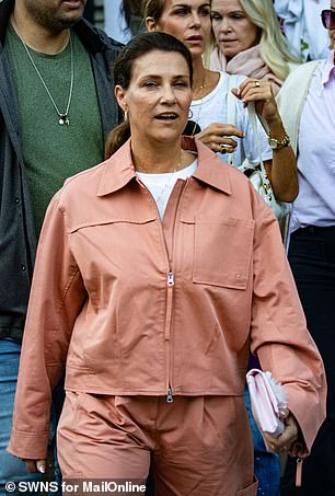 The 52-year-old, fourth in line to the Norwegian throne, was wearing a pink trouser suit as she left the Union Hotel in the picturesque fjordside village of Geirganger, where she had married yesterday.