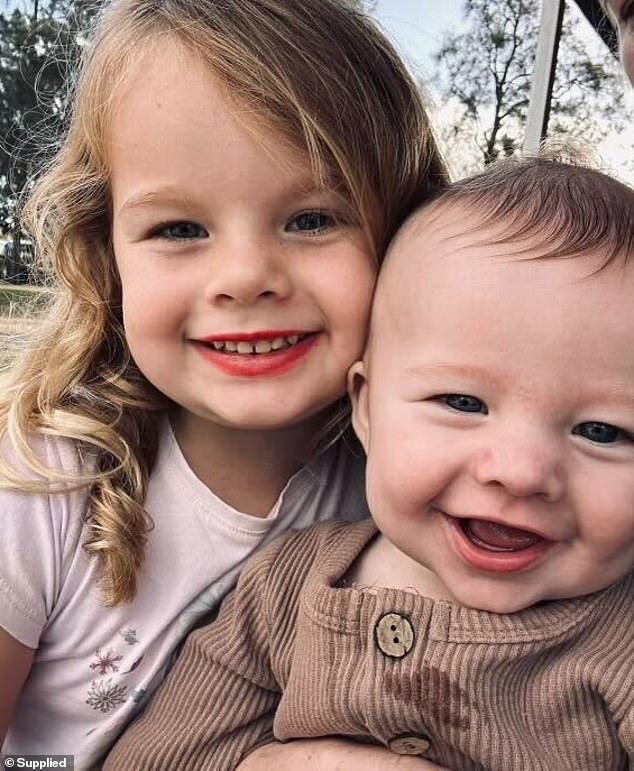 Archie's older sister Charlotte, now four, is pictured with nine-month-old Parker 'Archie' Read.