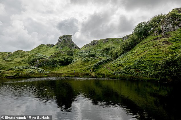 Skye's famous Fairy Pools are crystal-clear waters surrounded by emerald green hills.