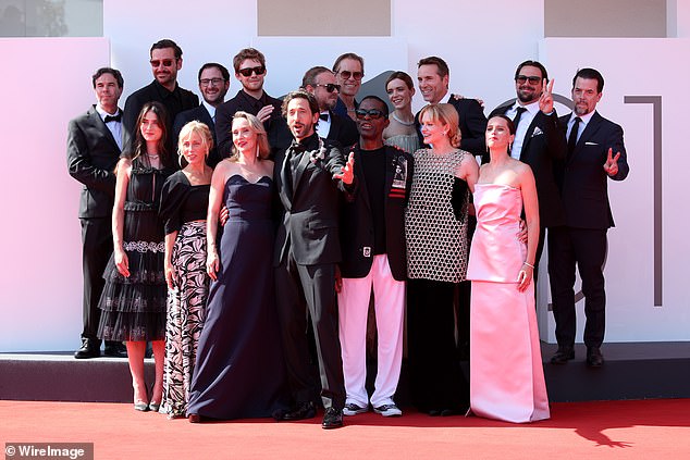 The Brutalist cast (l-r, back row): Joe Alwyn, Brady Corbet, Guy Pearce, Stacy Martin, Alessandro Nivola; (l-r, front row): Raffey Cassidy, Mona Fastvold, Adrien, Isaach de Bankolé, Emma Laird and Felicity Jones