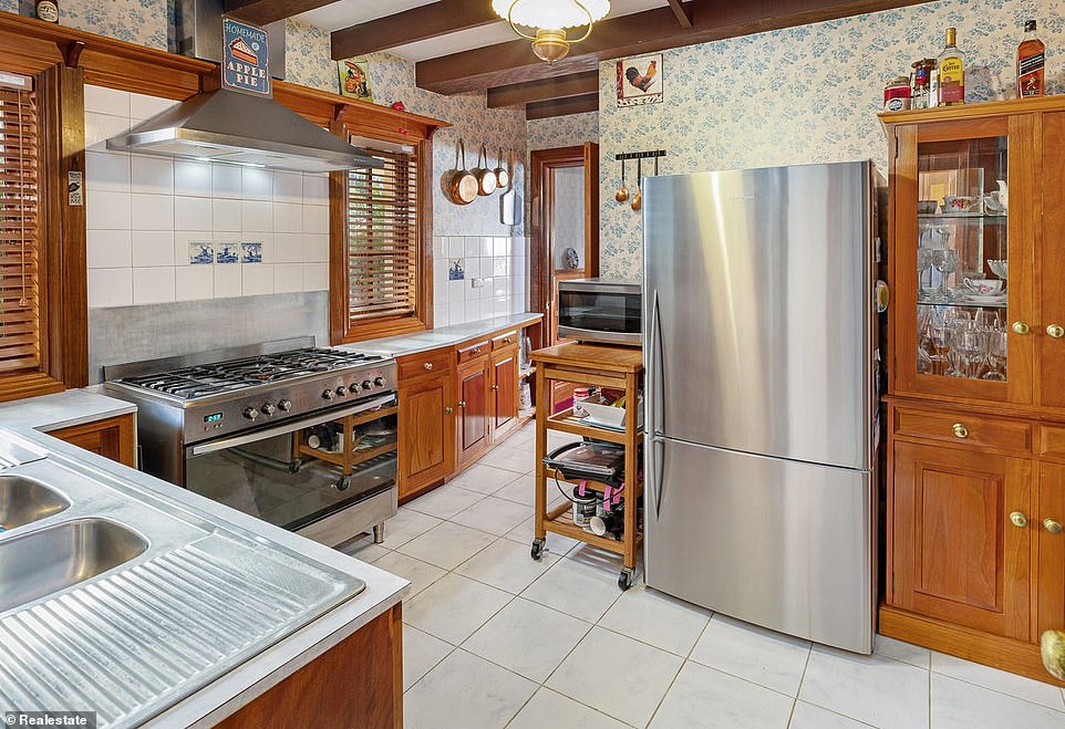 At the heart of the castle is the wooden kitchen, which features an eight-burner stove, a huge oven, enough room for a double refrigerator, and ample counter space.