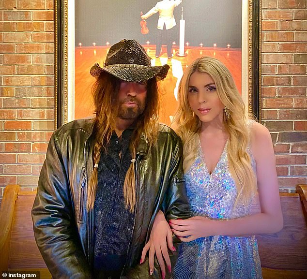 The Australian singer previously claimed she was forced to postpone the surgery, which was scheduled for May, when her ex Billy Ray Cyrus, 63 (left) filed for divorce just 24 hours before she was due to go under the knife.