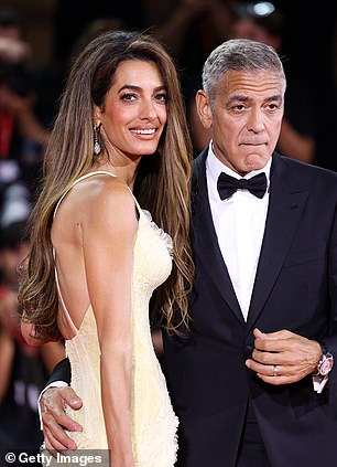 George Clooney is pictured on the red carpet in Venice with his wife, Amal