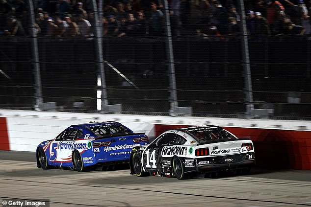 Kyle Larson, driver of the No. 5 HendrickCars.com Chevrolet, and Chase Briscoe, driver of the No. 14 HighPoint.com Ford, compete during the NASCAR Cup Series Cook Out Southern 500