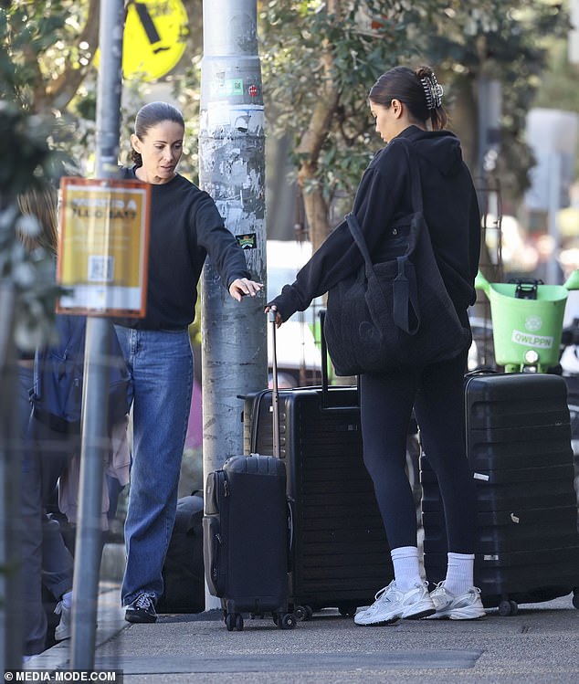 While helping her father and his partner load their suitcases, Stella chose to flaunt her genetically blessed features by slicking her hair back and securing it with a clip.