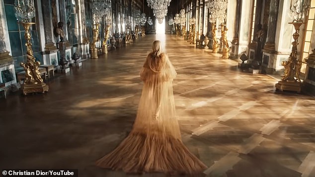 At one point, Riri (born Robyn Fenty) removes a sheer cape as she struts through the Hall of Mirrors inside the 17th-century property.