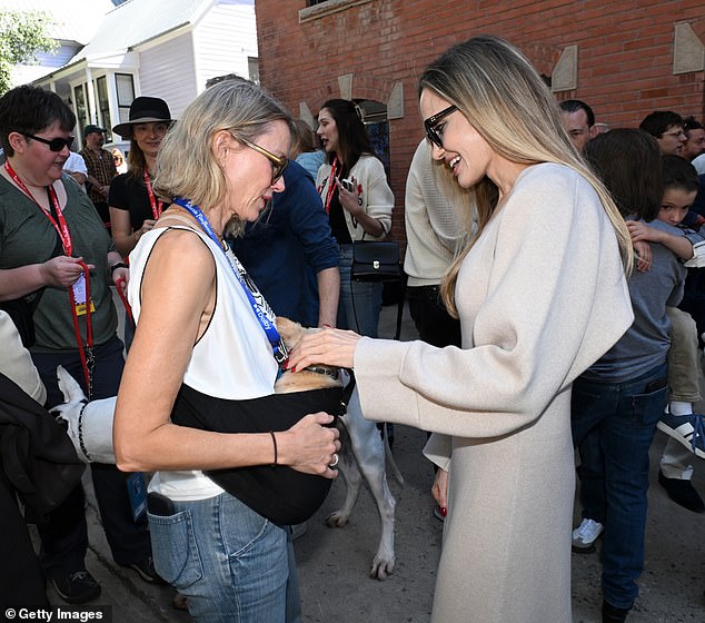 The mother of six was seen petting a small dog that Naomi was carrying in a baby carrier.