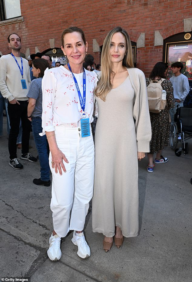 She also posed with actress Embeth Davidtz, 59, who looked chic in a long-sleeved blouse, white trousers and white sneakers.