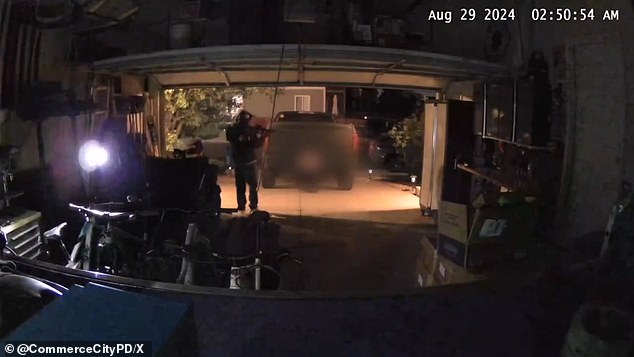 The thieves were caught on camera shining their flashlights into the garage.