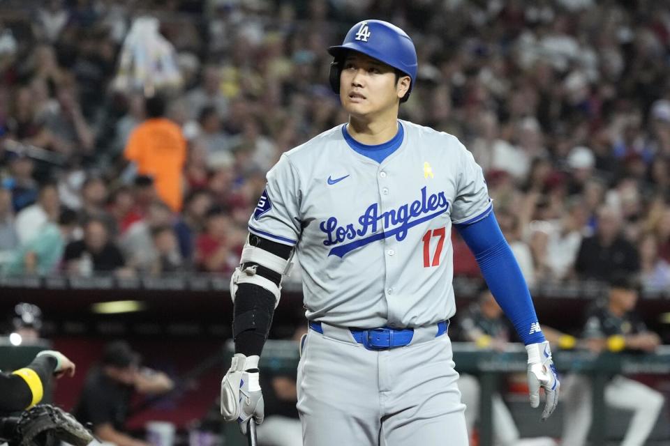 Dodgers star Shohei Ohtani reacts after striking out in the third inning Sunday against Arizona.