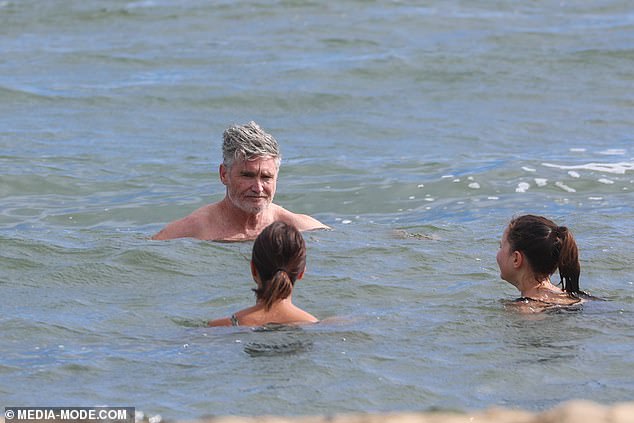 Melbourne's chilly temperatures didn't stop the comedian from stripping down to his shorts and taking a dip with his wife Holly and children Rafferty, 15, Sadie, 13, and Tess, 11.