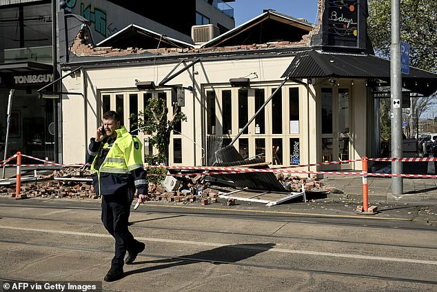 Winds of more than 110 km/h in Melbourne knocked down the facade of a building in the city