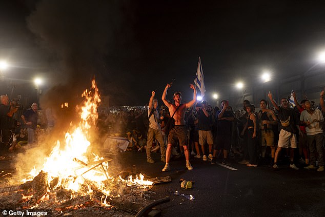 Protesters set a fire on a main street during a demonstration demanding a deal on hostages and denouncing Israeli Prime Minister Benjamin Netanyahu.