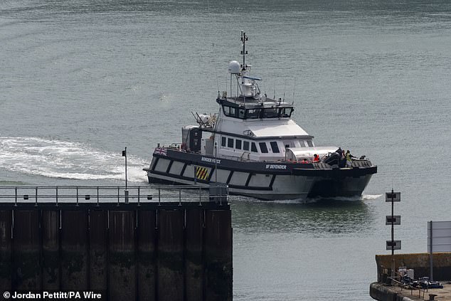 Pictured: A group of people believed to be migrants are taken to Dover, Kent, by Border Force on August 21.