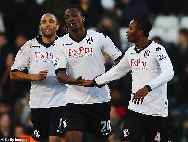 Paintsil (right) played in England for six years, spending three of those years at Fulham.