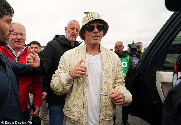 In July, Brad made a statement in a £320 Burberry bucket hat at the Grand Prix, bringing back the 90s trend and proving that his generation could rock Gen Z's go-to accessory too.