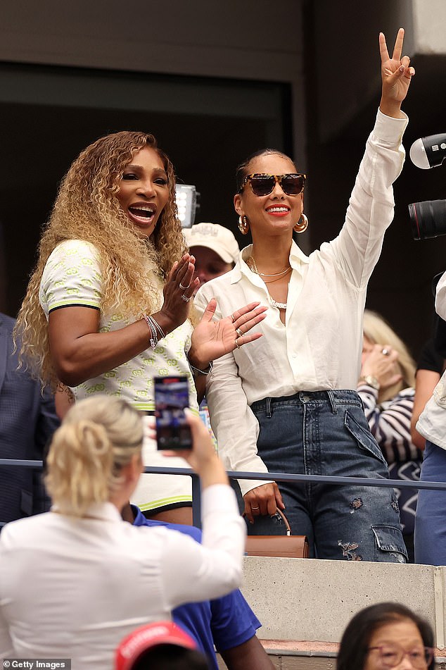 The singer-songwriter donned a pair of ripped cargo jeans to enjoy the tournament and accessorized her outfit with a pair of chunky gold earrings and several layered necklaces.