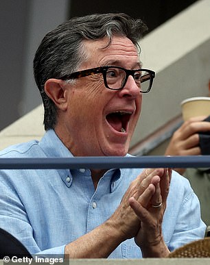 Comedian Stephen Colbert looked animated as he watched the action.