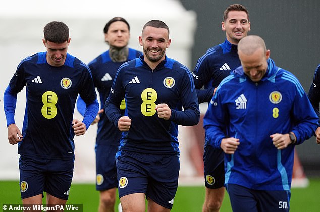 John McGinn prepares with his teammates ahead of the match against Poland on Thursday