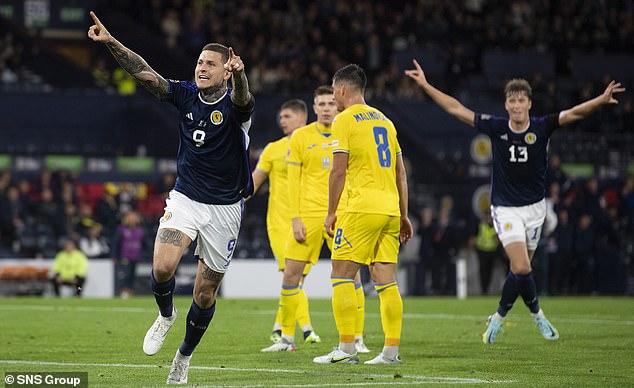 Lyndon Dykes savours a goal against Ukraine in the previous Nations League campaign