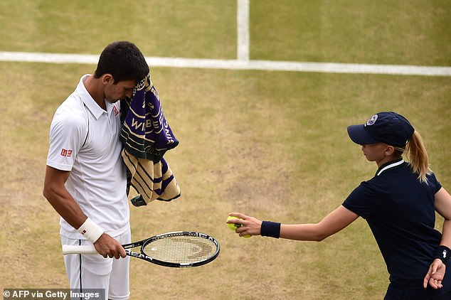 A ball girl with Djokovic, who once apologized for his anger with another ball girl at Wimbledon