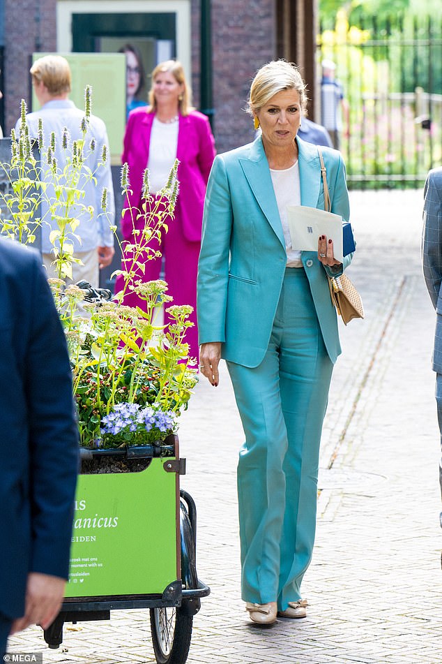 The royal was previously photographed wearing the turquoise satin gown in April when she visited The Hague.