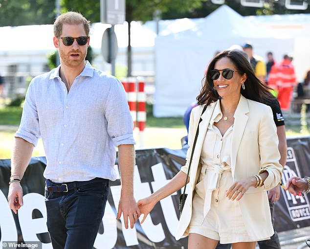 Harry and Meghan attend the cycling medal ceremony on the cycling track during day six of the Invictus Games in Dusseldorf, Germany, in 2023.