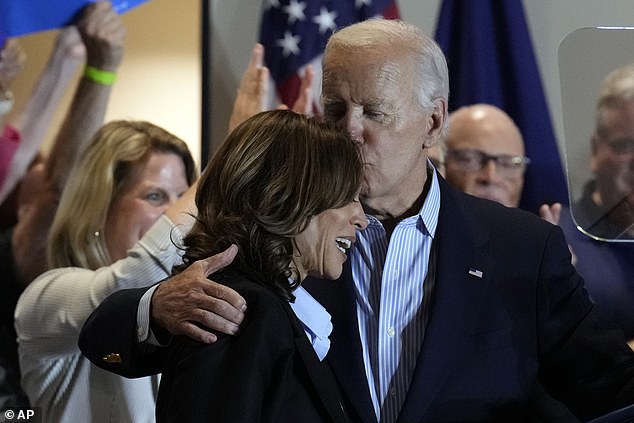 President Joe Biden gives Kamala Harris a kiss on the forehead