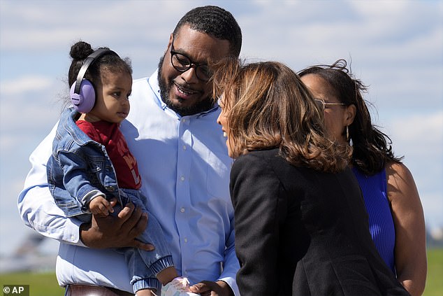 Vice President Kamala Harris greets Pennsylvania Lt. Gov. Austin Davis and his daughter Harper upon their arrival in Pittsburgh