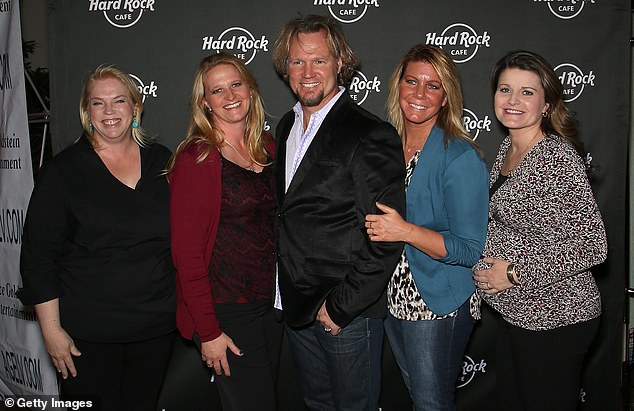 The couple's marital tensions were on full display in a new trailer for Sister Wives season 19, which was posted to social media last week; Kody (center) is pictured with his exes (L-R) Janelle, Christine and Meri, along with Robyn (R) in 2015 in Las Vegas.